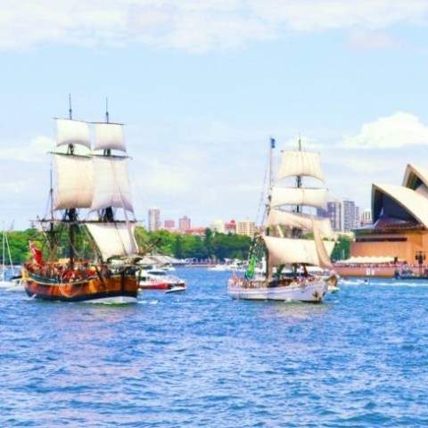 a boat is docked next to a body of water