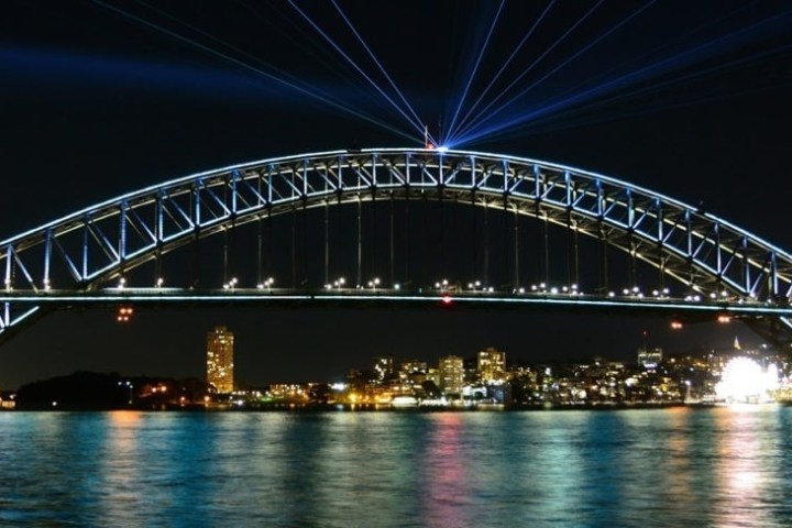 a close up of a bridge over a body of water